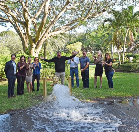 Council with gold hydrant and water flowing